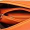 BELLE/百丽箱包橙色纳帕纹人造革手袋11462DX5