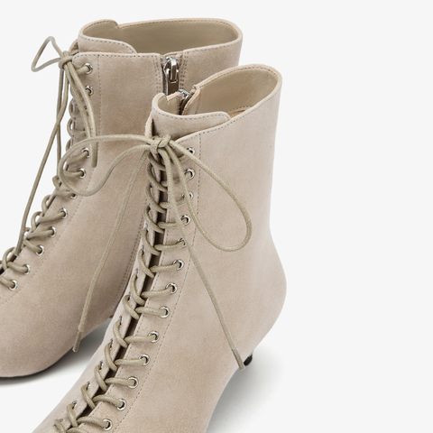 73hours女鞋混搭美学2025冬季新品尖头细跟系带时装靴