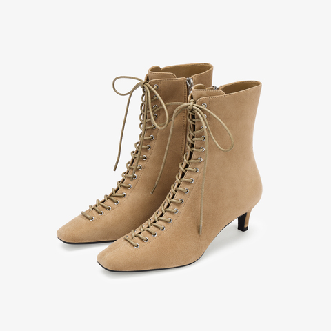 73hours女鞋混搭美学2025冬季新品尖头细跟系带时装靴