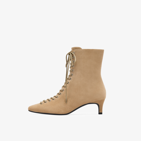 73hours女鞋混搭美学2025冬季新品尖头细跟系带时装靴