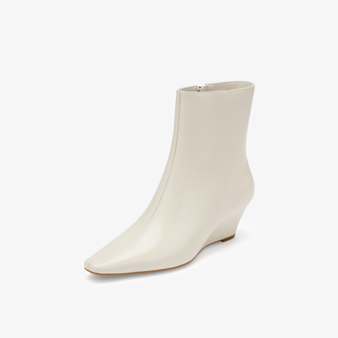 73hours女鞋都市剪影2025冬季新品坡跟尖头纯色时装靴