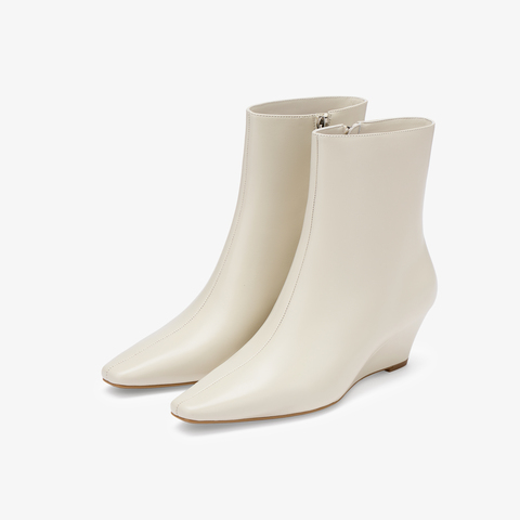 73hours女鞋都市剪影2025冬季新品坡跟尖头纯色时装靴