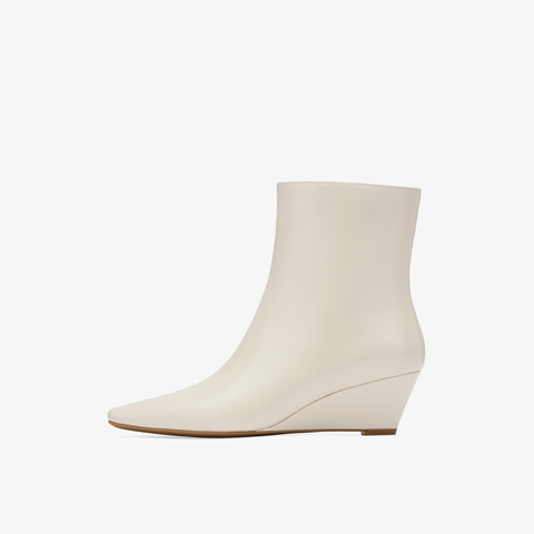 73hours女鞋都市剪影2025冬季新品坡跟尖头纯色时装靴
